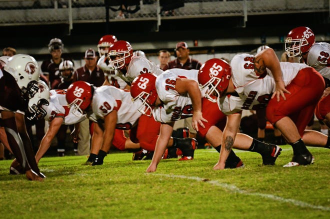Stigler's Nikita Muse (50), Lane McGuire (76), Alex Comyford (68) and Cade Shearwood (12) during the team's Friday, Sept. 28, game against Eufaula. PHOTO PROVIDED BY DIANA SHORES