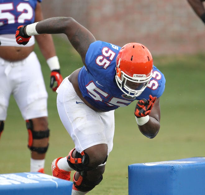 Florida Gator offensive lineman Roderick Johnson runs a drill during an open practice at Donald R. Dizney Stadium on the UF campus.