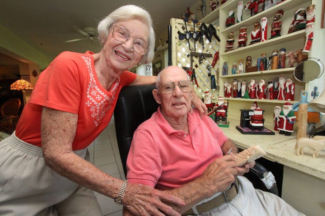 Evelyn and Richard Birdsall at Richard’s hobby work bench in their Palm Coast home.