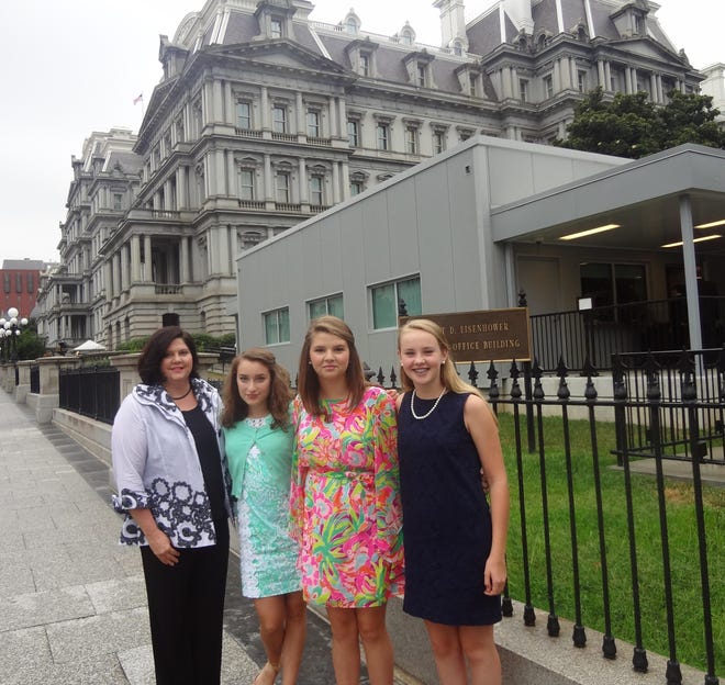 From left, Gaston Day School science teacher Julie Blalock and students Katie Danis, Grace Wynkoop and Mary Hunter Russell prepare to enter the White House gate on Aug. 12 in Washington, D.C.