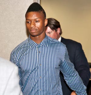 University of Oklahoma freshman Joe Mixon and his attorneys walk into Judge Steve Stice's courtroom in Cleveland County in Norman, Monday August 18, 2014. Photo By Steve Gooch, The Oklahoman