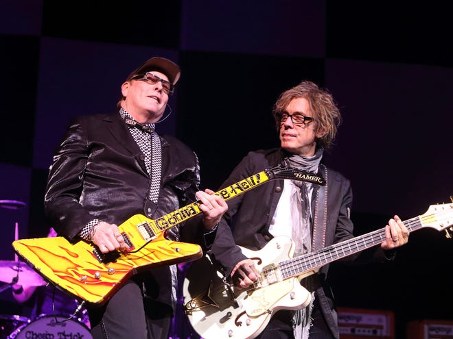 In this June 6, 2014 file photo, Rick Nielsen and Tom Petersson of the band Cheap Trick perform in concert at the American Music Theatre in Lancaster, Pa.