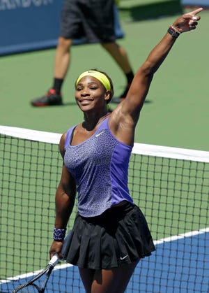 Serena Williams acknowledges the crowd after defeating Jelena Jankovic, from Serbia, 6-1, 6-3, during a match at the Western & Southern Open tennis tournament, Friday, Aug. 15, 2014, in Mason, Ohio. (AP Photo/Al Behrman)