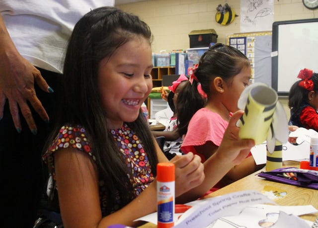 Rachel Rodemann • Times Record 
Sutton Elementary School kindergarteners Leah Facio, front, and Selena Uribe construct bees Monday on the first day of kindergarten in Jennifer Cagle's class. Monday marked the first day of school for Fort Smith Public School students, as well as Van Buren, Alma and Greenwood public schools. 
 Rachel Rodemann • Times Record / Ta'Lyciana Williams explores her new playground during a scavenger hunt with her classmates from Joni Rogers' Ballman Elementary School kindergarten class, Monday, Aug. 18, 2014. Monday marked the first day of school for Fort Smith Public School students, as well as Van Buren, Alma and Greenwood public schools. 
 Rachel Rodemann • Times Record / City Heights Elementary School students Jacob Jerrell, left, Madelyn Cochran and Hallie Rackley walk the red carpet, Monday, Aug. 18, 2014. Monday marked the first day of school for Van Buren Public School students, as well as Fort Smith, Alma and Greenwood public schools. 
 Rachel Rodemann • Times Record / Addison Dory explores her new playground during a scavenger hunt with her classmates from Joni Rogers' Ballman Elementary School kindergarten class, Monday, Aug. 18, 2014. Monday marked the first day of school for Fort Smith Public School students, as well as Van Buren, Alma and Greenwood public schools. 
 Rachel Rodemann • Times Record / Ta'Lyciana Williams explores her new playground during a scavenger hunt with her classmates from Joni Rogers' Ballman Elementary School kindergarten class, Monday, Aug. 18, 2014. Monday marked the first day of school for Fort Smith Public School students, as well as Van Buren, Alma and Greenwood public schools.