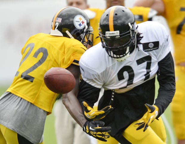 William Gay (22) breaks up a pass to LeGarrette Blount (27)during Pittsburgh Steelers training camp on Monday, July 28, 2014, at Heinz Field.