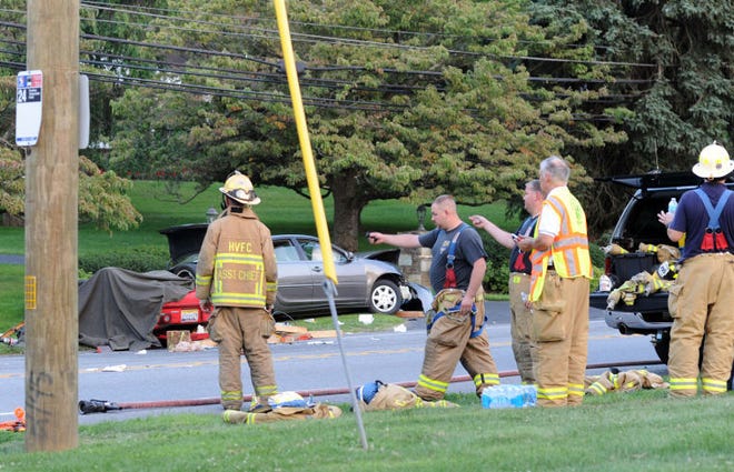 EDITORS NOTE: CORRECTS TO FATAL ACCIDENT: HUNTINGDON VALLEY, PA - AUGUST 19: Rescue and fire personnel work to remove victims from the scene of a fatal accident on Huntingdon Pike August 19, 2014 in Huntingdon Valley, Pennsylvania. (Photo by William Thomas Cain/Cain Images)