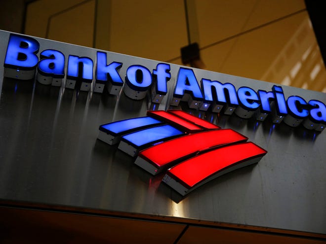This Tuesday, Jan. 14, 2014 file photo shows a Bank of America sign in Philadelphia. Officials familiar with the deal say Bank of America has reached a record $17 billion settlement with federal and state authorities over its role in the sale of mortgage-backed securities in the run-up to the 2008 financial crisis.