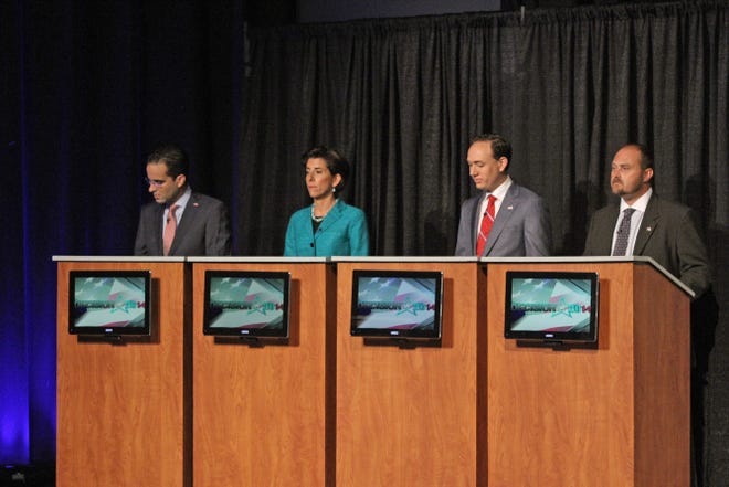 Democratic candidates for governor, from left, Angel Taveras, Gina Raimondo, Clay Pell and Todd Giroux, answer questions during a forum hosted by WJAR's Bill Rappleye at Johnson & Wales University in Providence on July 17.