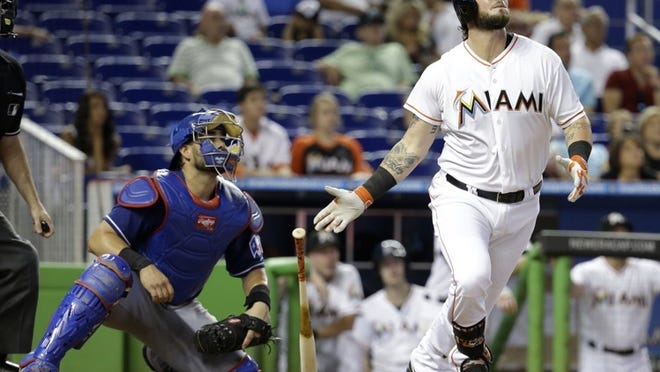 Home runs in the ninth inning Wednesday by Marcell Ozuna and Jarrod Saltalamacchia, above, weren’t enough as the Marlins lost 5-4 to Texas. (AP Photo/Lynne Sladky)