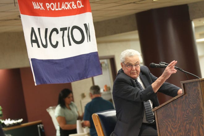 Auctioneer Bob Resnick conducts the state unclaimed property auction in Providence on Saturday.