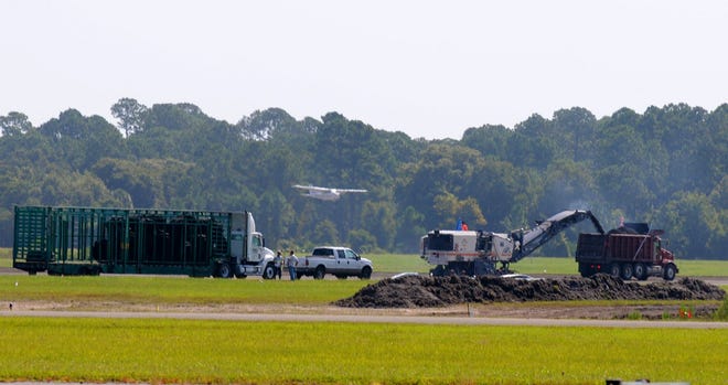 A single-engine plane comes in for a landing on the secondary runway during the first week of the repaving project on the main runway at DeLand Municipal Airport.
