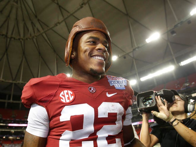 Alabama wide receiver Christion Jones celebrates by wearing the Old Leather Helmet trophy after the Crimson Tide beat Virginia Tech 35-10 in the 2013 season opener at the Chick-Fil-A Kickoff Game in the Georgia Dome in Atlanta. Alabama opens the 2014 season again in Atlanta against West Virginia.