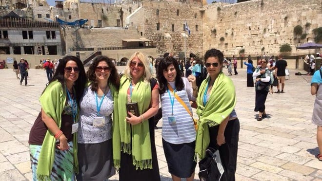 Outside the Western Wall in Jerusalem are mothers from northern and central Palm Beach County who attended the recent Jewish Women’s Renaissance Project; from left, Randi Yanow, Debbie Letter Sirlin, Melanie Goldsobel, Bruchy Cheplowitz and Melanie Jagendorf Brill. Not pictured is Faith Sorgman.