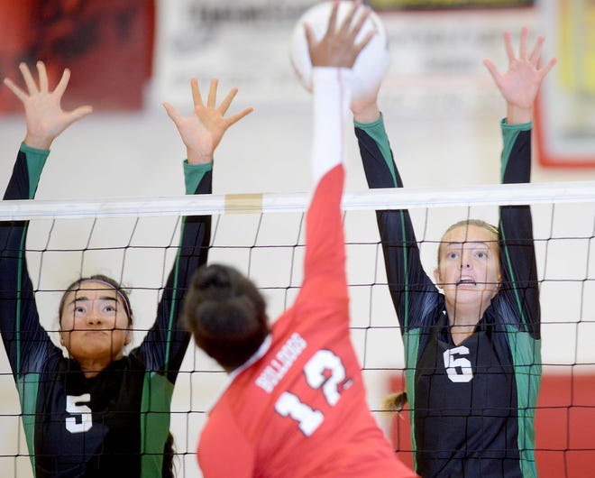 Choctawhatchee's Kassandra Fairly, left, and Alyssa Sehman, right, go up for a block against Crestview's Lakayla Robinson on Tuesday.