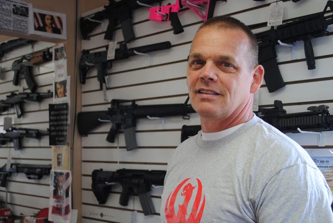 Sakonnet River Outfitters owner Randy Lebeau appears in this file photo. Lebeau, who is planning to build a larger gun store and firing range next to his shop in Tiverton, said he will continue with his plans despite the town's new gun range ordinance.