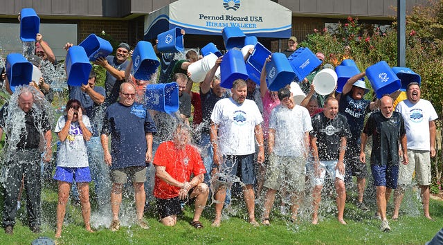 BRIAN D. SANDERFORD • TIMES RECORD - Employees at Pernod Ricard USA Fort Smith facility participate in the ALS Ice Bucket Challenge on Tuesday, Aug. 26, 2014. Managing Director Melissa Hanesworth, second from left, took part in another Ice Bucket Challenge on Friday and challenged her team at Pernod Ricard to do the same. Hanesworth said she hopes it will bring attention to the fundraiser for other Fort Smith companies and challenged the Fort Smith Regional Chamber of Commerce, Littlefield Oil, Trane, Rheem, Baldor and others to participate.