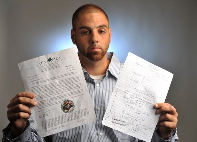 Derick Eaton holds a copy of his medical marijuana certificate, left, and a judge’s order for the Braintree Police to return his confiscated money and marijuana.