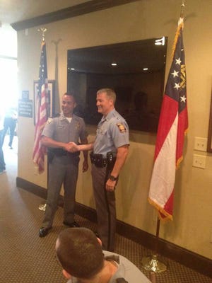South Carolina Highway Patrol Lt. Nicklous King shook hands with Georgia Capt. Allen Marlowe to kick off the "Hands Across the Border" campaign Thursday.