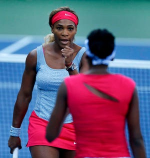 Serena Williams and Venus Williams beat Timea Babos and Kristina Mladenovic in three sets on Thursday.
