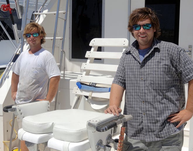 The Cox brothers, David, left, and Paul, say fishing "is it." For David, who mans the deck, his job is to help customers catch fish, while Paul as captain has to find the fish.