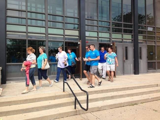 Galesburg Education Association members exit Galesburg High School around 2 p.m. today after reportedly ratifying a new contract.