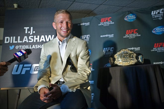 UFC Bantamweight champion T.J. Dillashaw of Angels Camp talks with reporters at the UFC Ultimate Media Day at Sleep Train Arena in Sacramento. Dillashaw will fight Renan Barao in a rematch for the title at the arena on Saturday. CLIFFORD OTO/THE RECORD