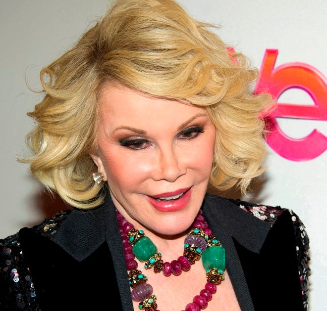 In this Jan. 19, 2012, file photo, Joan Rivers attends a screening of the Season 2 premiere of WE TV's "Joan & Melissa: Joan Knows Best?" in New York. Two police officials say Rivers has been rushed in cardiac arrest from a doctor's office to a New York City hospital on Thursday, Aug. 28.