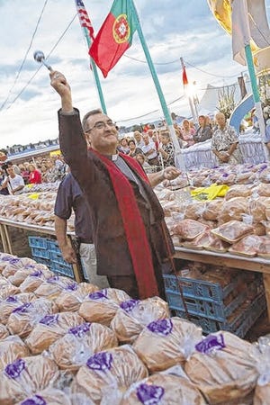 PHOTO BY MICHAEL SMITH/FALL RIVER SPIRIT
Bishop Manuel da Silva Rodrigues Linda of Portugal blesses the “pensoes” of sweet bread and pork before they are distributed at the Great Feast of the Holy Ghost of New England.