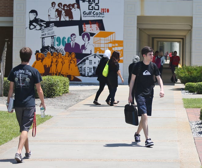 Students walk through campus at Gulf Coast State College on Wednesday.