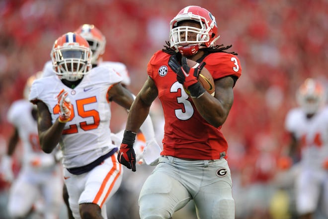 Georgia junior running back Todd Gurley rushes for one of his four touchdowns in Saturday's win over Clemson.