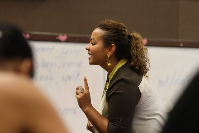 Malaika Alexander, 33, the daughter of Peace Corps volunteers, teaches English at the Genesis Center in Providence.