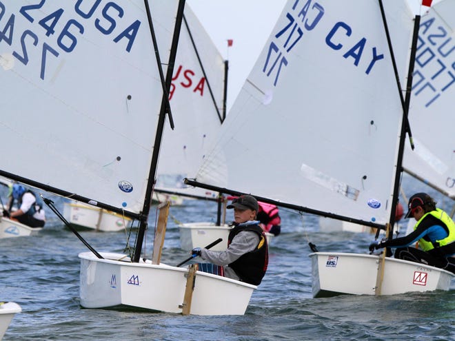 Sailor Thommie Grit, 10, of Sarasota, in middle, participated in several races during the 68th Annual Labor Day Regatta, hosted by the Sarasota Sailing Squadron over the holiday weekend in Sarasota.
