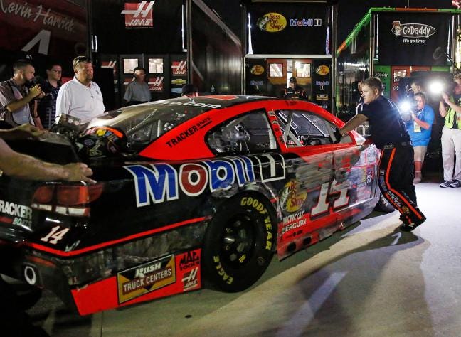 Tony Stewart's car in loaded into the team hauler after hitting the wall in a Sunday's Sprint Cup race at Atlanta Motor Speedway on Sunday in Hampton, Ga.