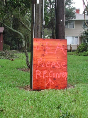 MARY MARAGHY/file photo A sign pleading with JEA to restore the electric was a lament that many Clay County residents uttered during the storm season of 2004. With declining electric, water sales, JEA in search for new ways to make money.