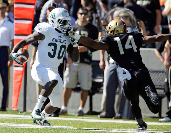 Eastern Michigan senior tailback Bronson Hill (30) rushed for 1,101 yards last season. At 5-foot-10, 215 pounds, he's a tough inside runner who also has a burst to the outside. (AP Photo/Mike Groll/FILE)
