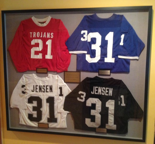 Clockwise from top left: Derrick Jensen's football jerseys from Osawatomie (Kan.) High School, the University of Texas-Arlington, the Oakland Raiders and the Los Angeles Raiders.