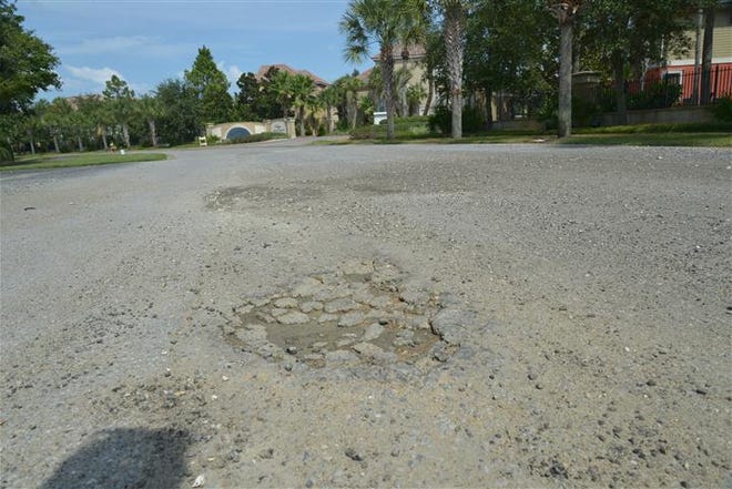 Traveling along Regions Way in Destin is a bumpy endeavor, as the road is full of potholes. Gravel was recently added to the stretch of roadway to help.