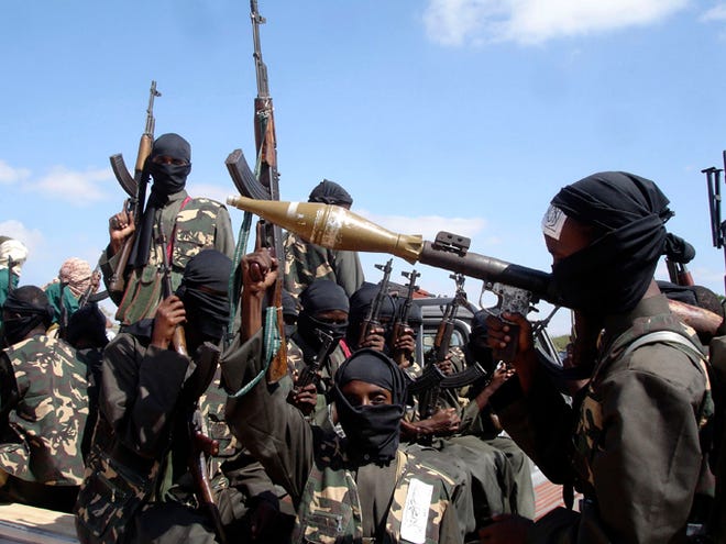 In this Dec. 8, 2008, photo, armed al-shabab fighters on pickup trucks prepare to travel into the city, just outside Mogadishu, in Somalia. U.S. military forces targeted the Islamic extremist al-Shabab network in an operation Monday in Somalia, the Pentagon said.
