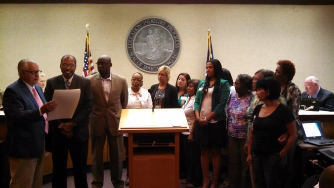 Mayor Junie White presents proclamation.