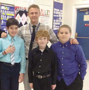 Bryan Belanger (SES interim principal) with middle school students Andrew Litcofsky, James Quinn, and John Greene