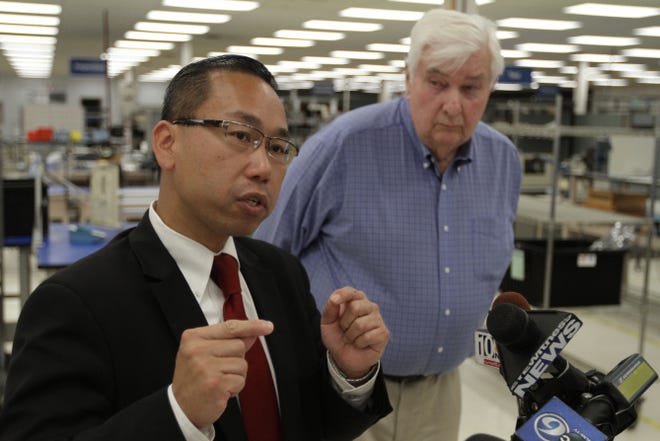 Former Gov. Lincoln Almond campaigns with Cranston Mayor Allan Fung at VR Industries Inc., in Warwick.