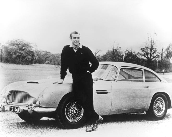 Sean Connery and James Bond's Aston Martin in 1964’s “Goldfinger.” As Bond, Connery allowed the audience to get the joke, but never himself.