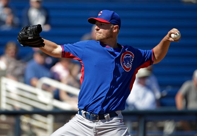Virginia graduate Eric Jokisch throws during a Chicago Cubs spring training game against the Milwaukee Brewers Monday, March 3, 2014, in Phoenix. (AP Photo/Morry Gash)
