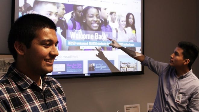 Round Rock school district interns Jorge Hernandez and Sameel Mawani present part of a website project Sept. 2.