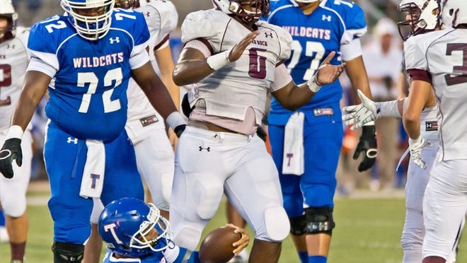 Breylin Mitchell celebrates after stopping Marques Hatcher of Temple during the game against Temple at Wildcat Stadium. Henry Huey for Round Rock Leader.