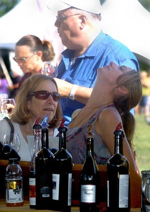 People sample wine from Tomasello Winery of Hammonton during last year's festival.