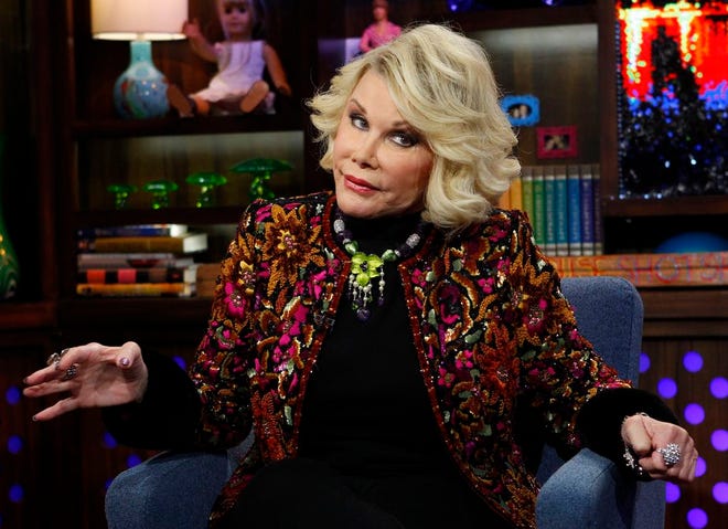 In this Feb. 16, 2012 photo provided by Bravo, Joan Rivers appears on the "Watch What Happens Live" show in New York. Rivers, the raucous, acid-tongued comedian who crashed the male-dominated realm of late-night talk shows and turned Hollywood red carpets into danger zones for badly dressed celebrities, died Thursday, Sept. 4, 2014. She was 81. Rivers was hospitalized Aug. 28, after going into cardiac arrest at a doctor's office.