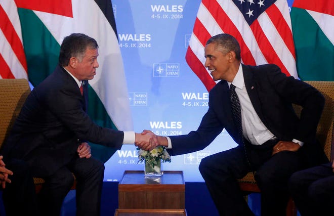 President Barack Obama shakes hands with Jordan's King Abdullah II during their meeting at the NATO summit at Celtic Manor in Newport, Wales, Thursday, Sept. 4, 2014. (AP Photo/Charles Dharapak)