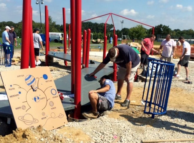 Volunteers help build an inclusive playground at the Hainesport Municipal Complex.