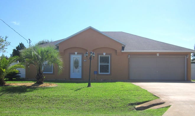 This house on Landsdowne Lane in Palm Coast sold for $140,000. It has three bedrooms and two baths in 1,371 square feet of living space. Built in 2003, it also has a screened lanai.